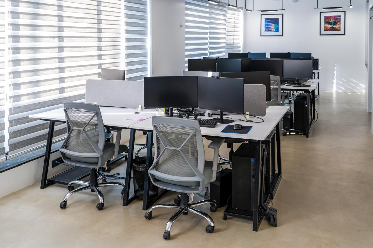 Commercial office desk layout with abundant natural light